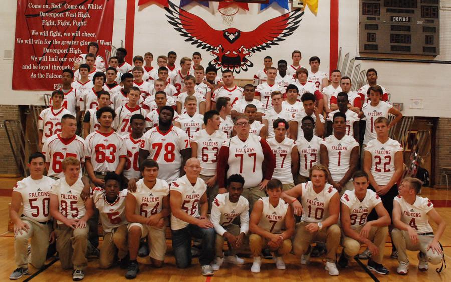 The football team poses after the pep assembly on Aug. 27 in the gym. They went on to win the game against North that night 16-14.