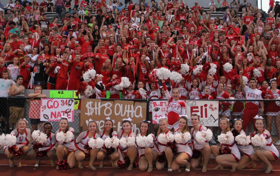 West High students fill the stands with red and white at the football game against Central on Sept. 4 at Brady Stadium.