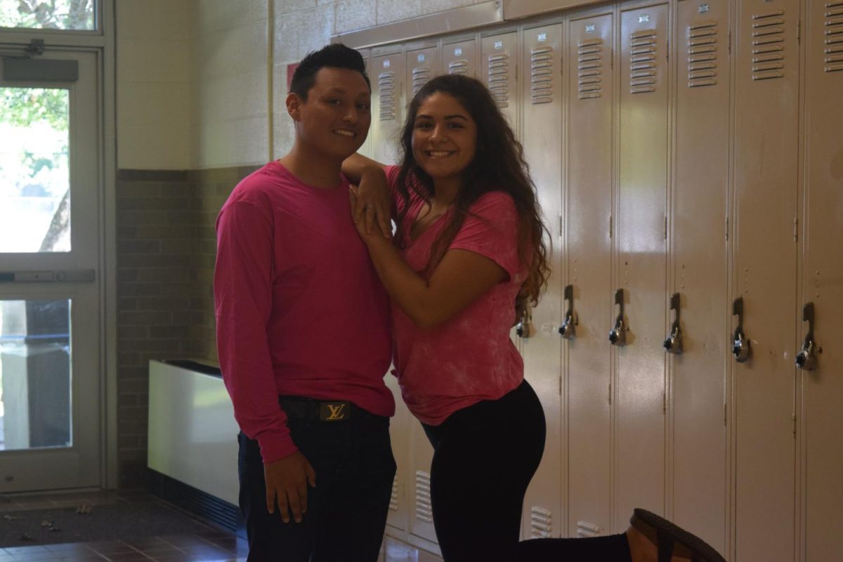 Thursdays theme was class colors, and seniors were assigned the color pink. Gracie Gutierrez and Diego Morales show there school spirit by wearing their class color.