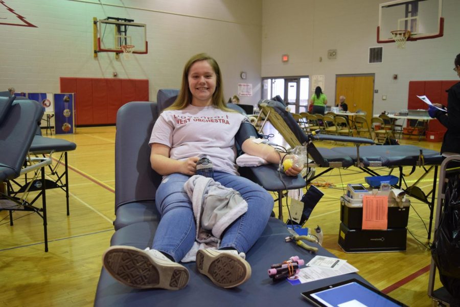 First time donor and sophomore Hannah Neyens lays patiently while donating. 