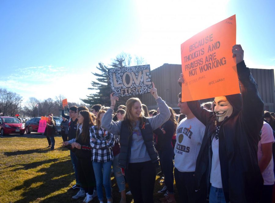 Students+hold+up+signs+in+an+effort+to+change+the+world+and+end+gun+violence.