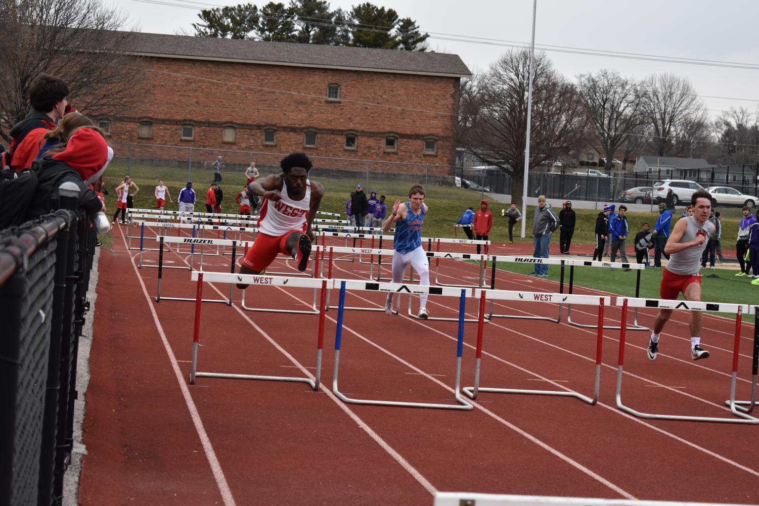 Senior Tyler Williams hurdling at one of the few meets that the boys track team had at Brady Street Stadium.