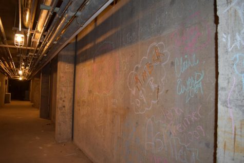 Teachers would allow students to take chalk or markers and write their names on the walls for a type of keepsake, head custodian Pat Clark said.