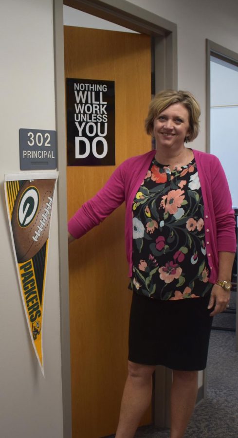 Williams decorated her door with a poster and a Packers flag to show her personality. 