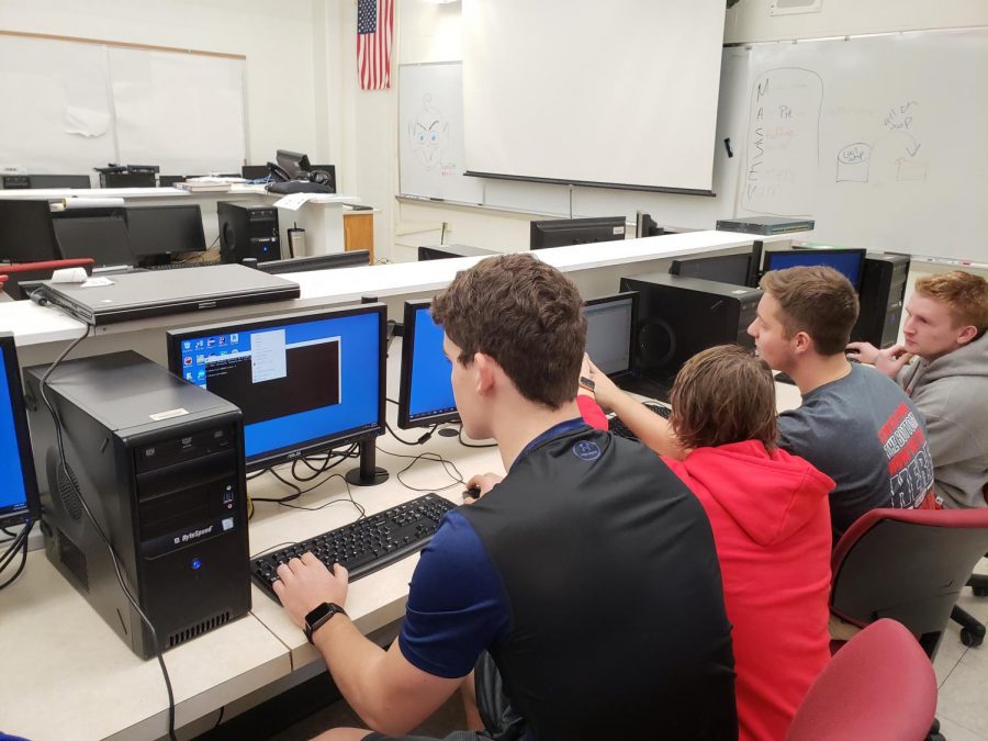 Seniors+Jack+Reis%2C+Chase+Thompson%2C+Dusty+Beehler%2C+and+Adam+Gibson+are+working+on+Packet+Tracer.+