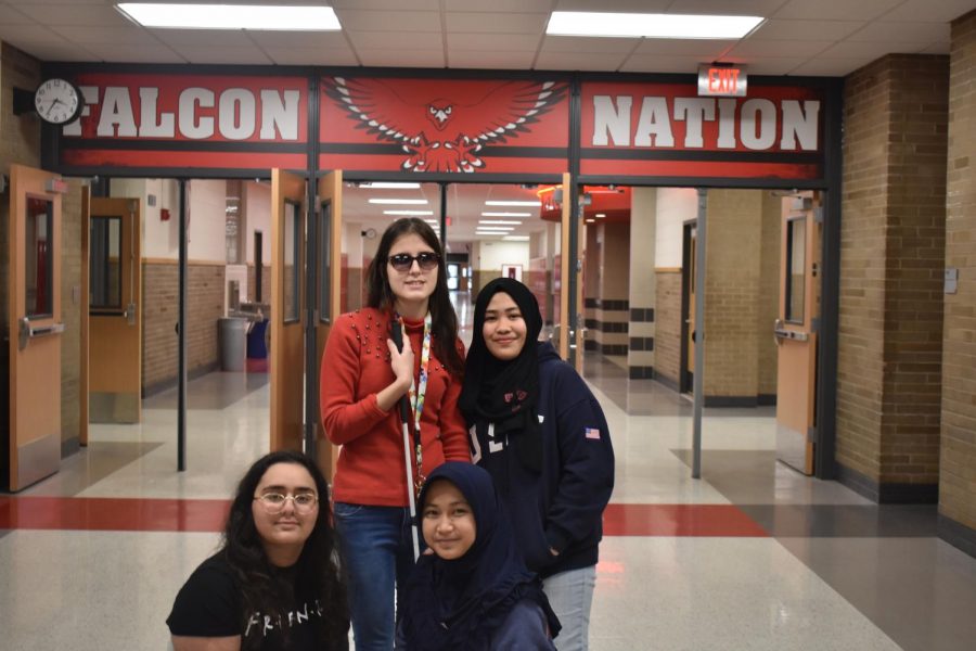 From left: Becca Saad (Lebanon), Andjela Ognjanovic (Serbia), Syafira Adani (Indonesia) and Farnaiza Gulam (Philippines) pose to show their Falcon spirit. These foreign exchange students are spending an academic year at Davenport West to experience what American high school life is like. I would like to say thank you for making me feel welcomed! You guys are the best, junior Becca Saad said. 