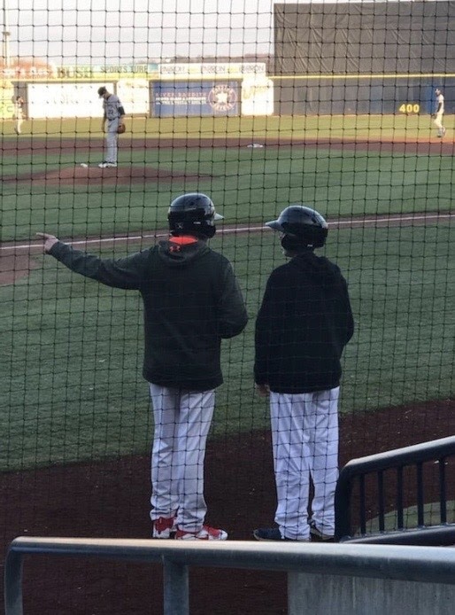 McCrery (Left) and Parcel (Right) converse on the field during a River Bandits game. McCrery learned substantial amounts of insight while being a bat boy and was even taught some Spanish by some of the players. “Jake loved his time as a bat boy and gained knowledge and experiences about baseball,” R. McCrery said.
