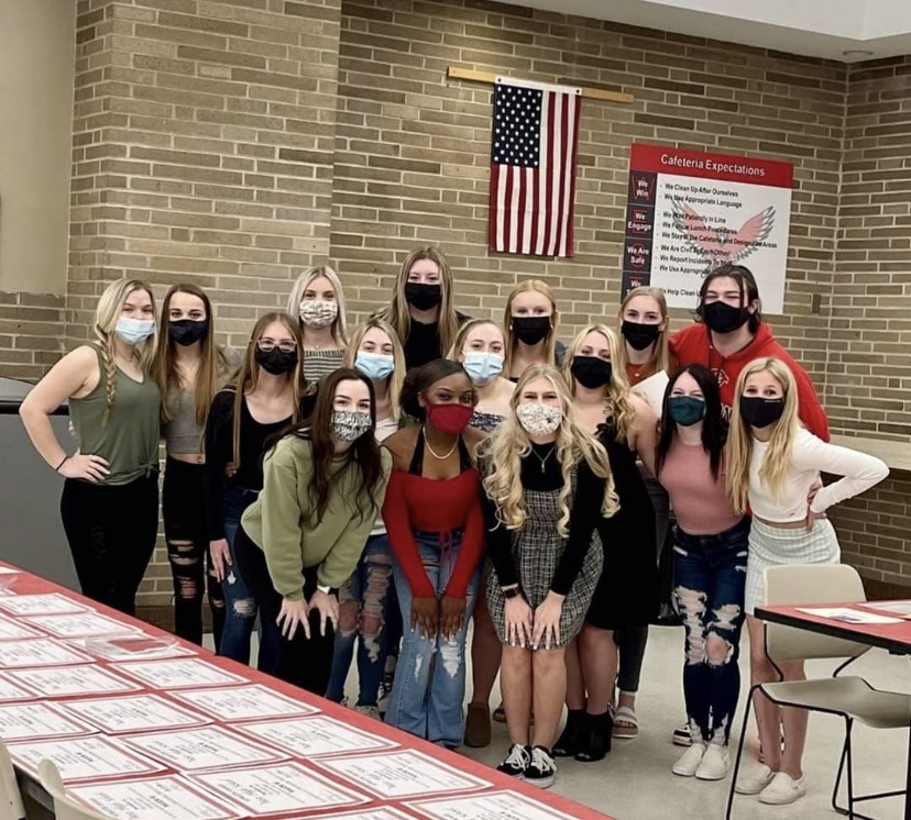 Davenport West Varsity Cheerleaders pose for the last picture of the 2020 season.
