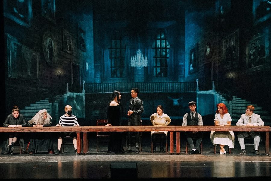 One+big+happy+family.+West+High+students+perform+their+final+dress+rehearsal+before+their+big+performance.+The+Addams+Family+musical+was+supposed+to+be+performed+last+year+before+it+was+cancelled+due+to+the+pandemic.+%0A%0A
