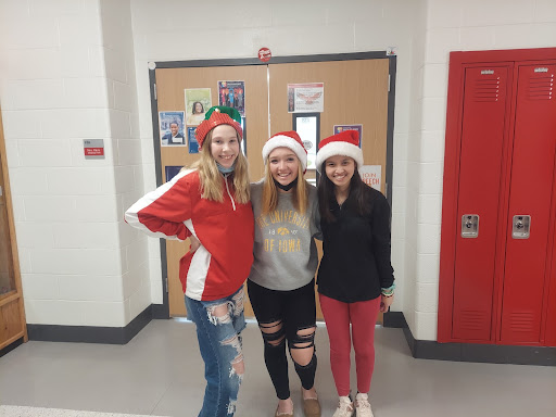 Arriana Plies ‘25, Karlee Krenz ‘23, and Thi Nguyen ‘22 all celebrate the upcoming holiday season by wearing their holiday headwear. They were roaming the halls, working on putting together some holiday fun for our teachers. 