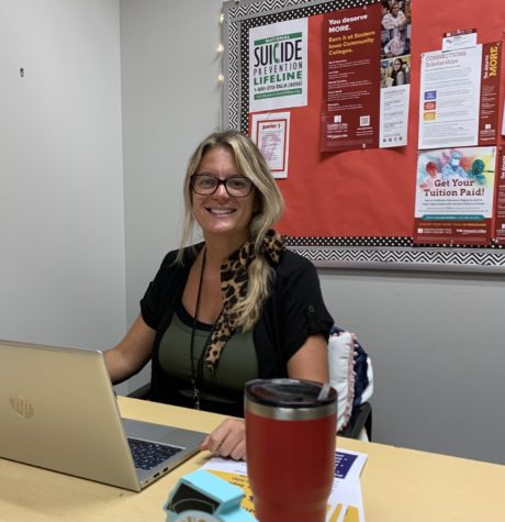Ashley Dailey smiles from her new desk. Dailey was hired to be the new GEAR UP instructor. 