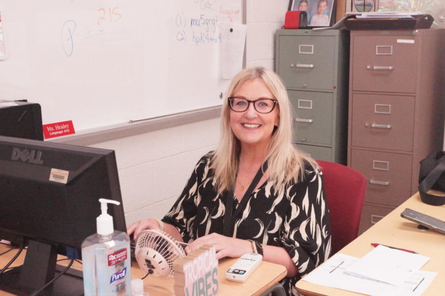 Katie Nash smiling from her desk. She was hired as one of the new
English/Language Arts teachers for West.