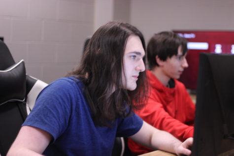  Caleb McDaniel ‘23 and Zane Augustine ‘24 sit at monitors in the esports room by the library. Esports are a big deal in other countries, such as South Korea. According to Dearborn, entire stadiums have been sold out just to watch people play games.