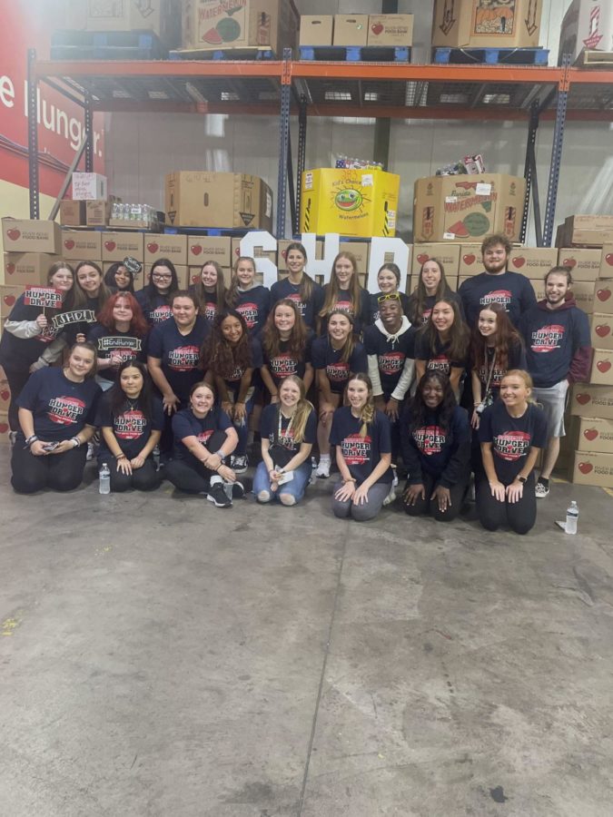 West High School Student Senate heads down to the River Bend Food Bank to deliver their food collections for the Student Hunger Drive and celebrate all their hard work on loading day.  