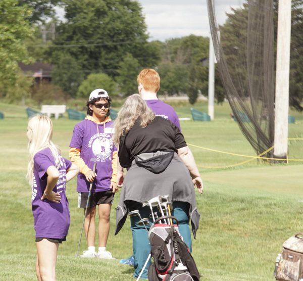 Samyr Andilog helps out at a golfing event for Falcon Friends.