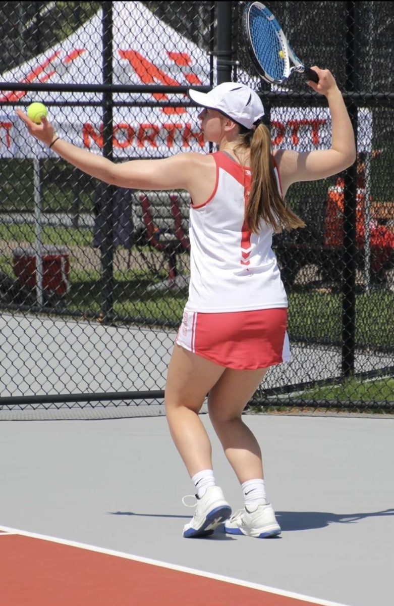 Senior Ellie Holdorf plays tennis at the MAC tournament, which is one of the three sports she participates in.