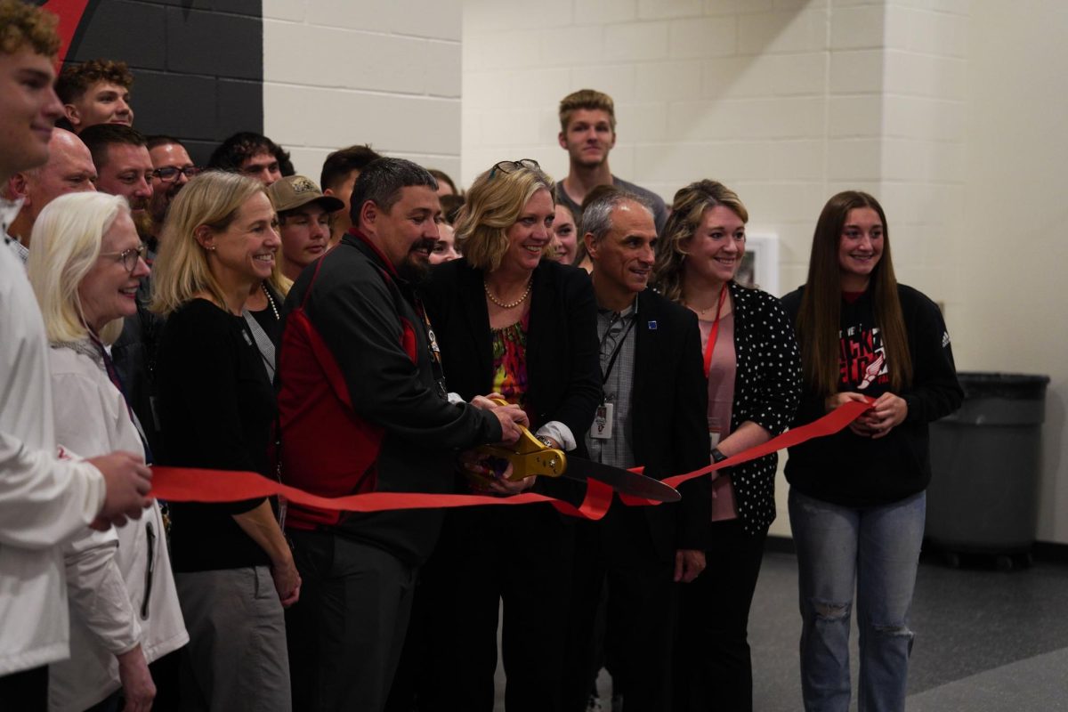 West High students and staff celebrate the grand opening of their new facilities on Thursday, Nov. 14, 2024 by cutting the ribbon to the enjoyment of students, parents, and coaches alike.