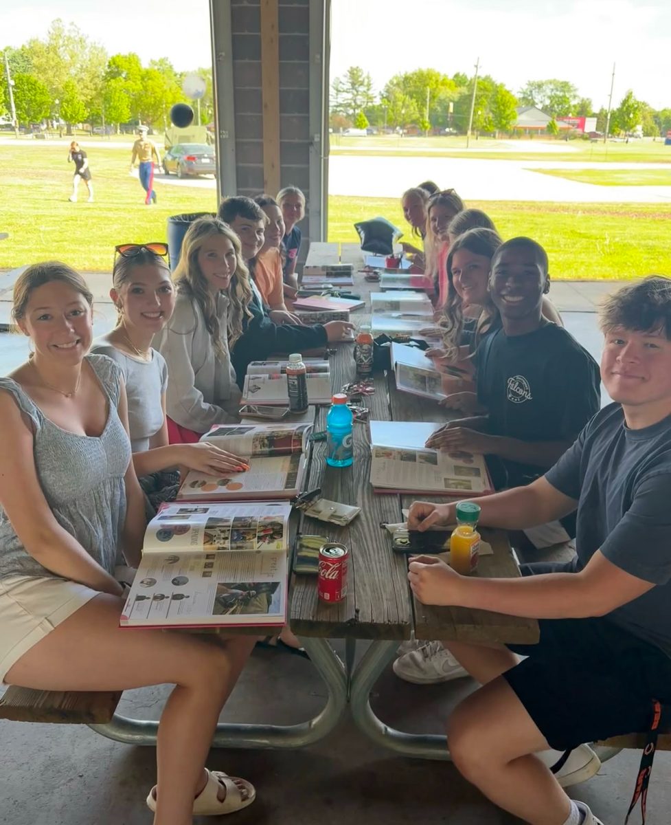 West seniors gather together while they look at the yearbook and enjoy their time together before graduation.